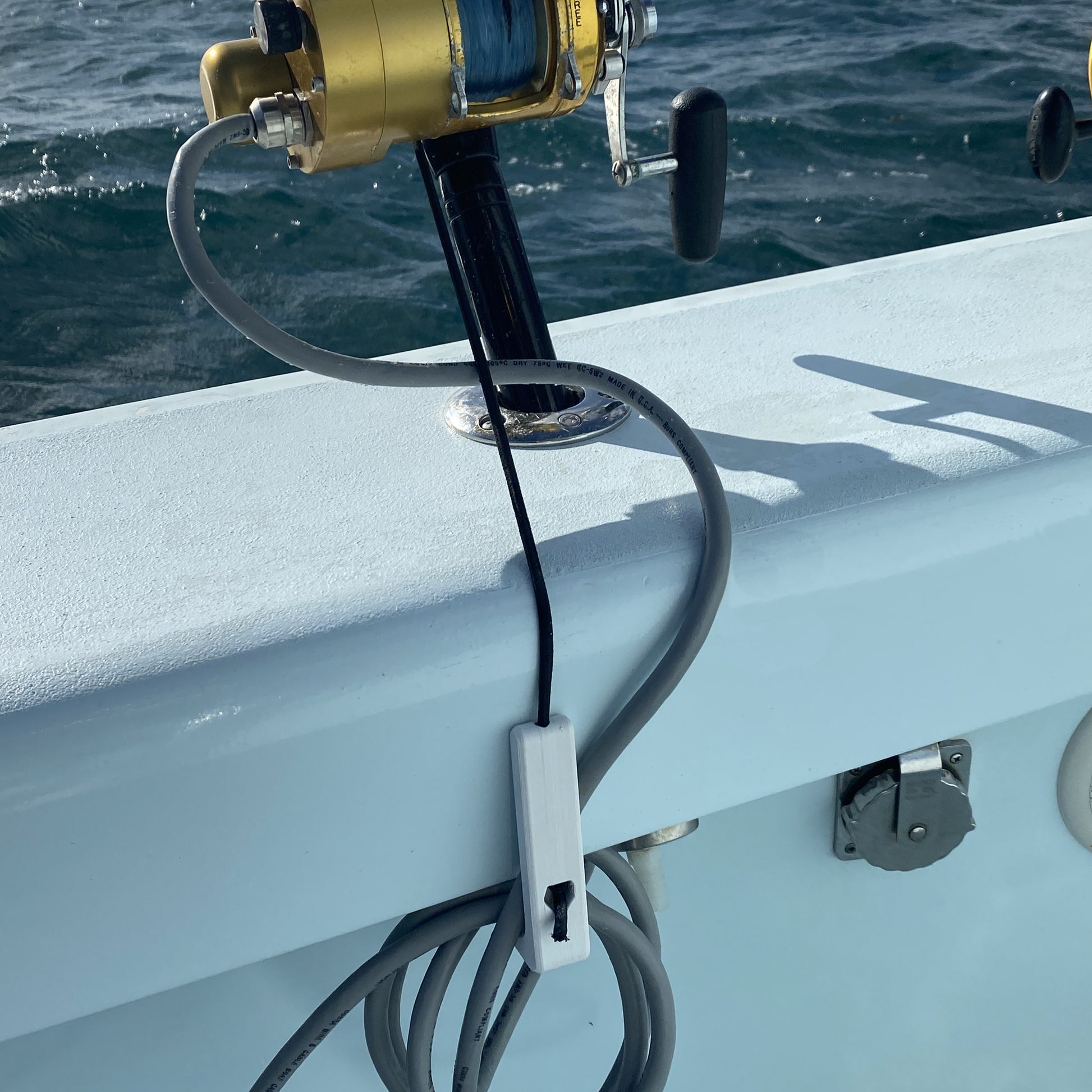 Rod Bungee - R&R Tackle Co. | Premium Saltwater Fishing Tackle. Built with durable, marine-grade materials, this system is especially useful for kite fishing and offshore fishing, where waves, wind, or a strong strike can easily send a rod overboard. 