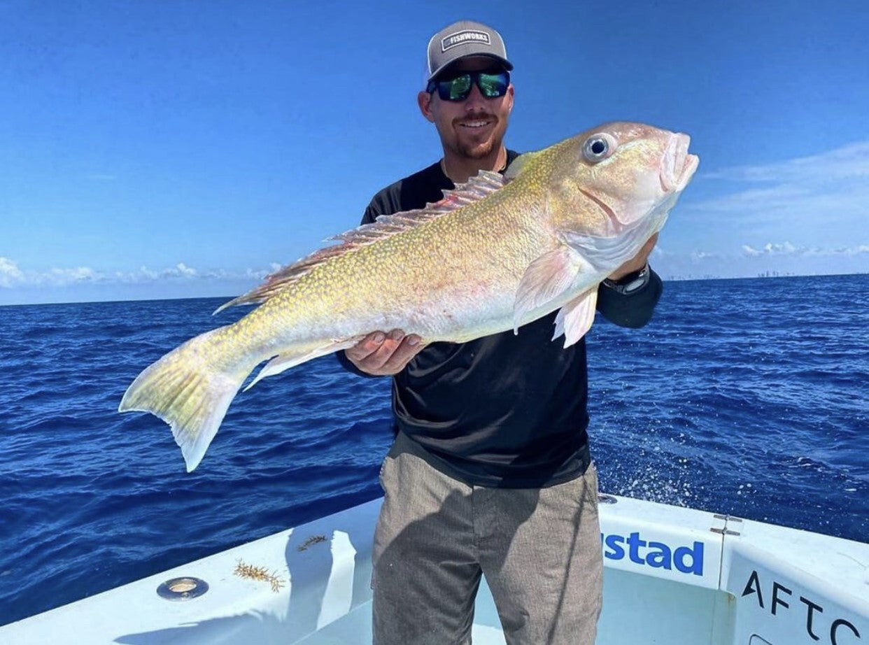 Captain Austin Porter with a nice tile caught aboard miss britt charter boats using RandR tackle deep drop rigs