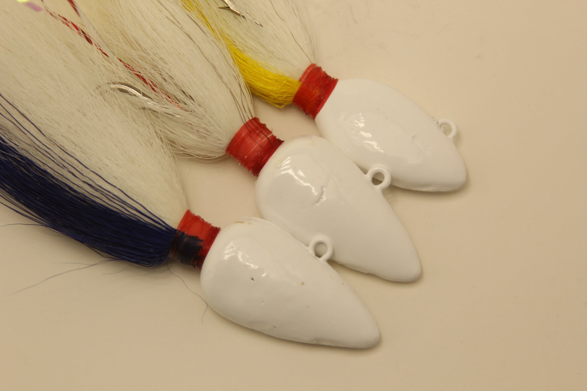 Bucktail jigs, Saltwater jigs, Hand tied jigs.