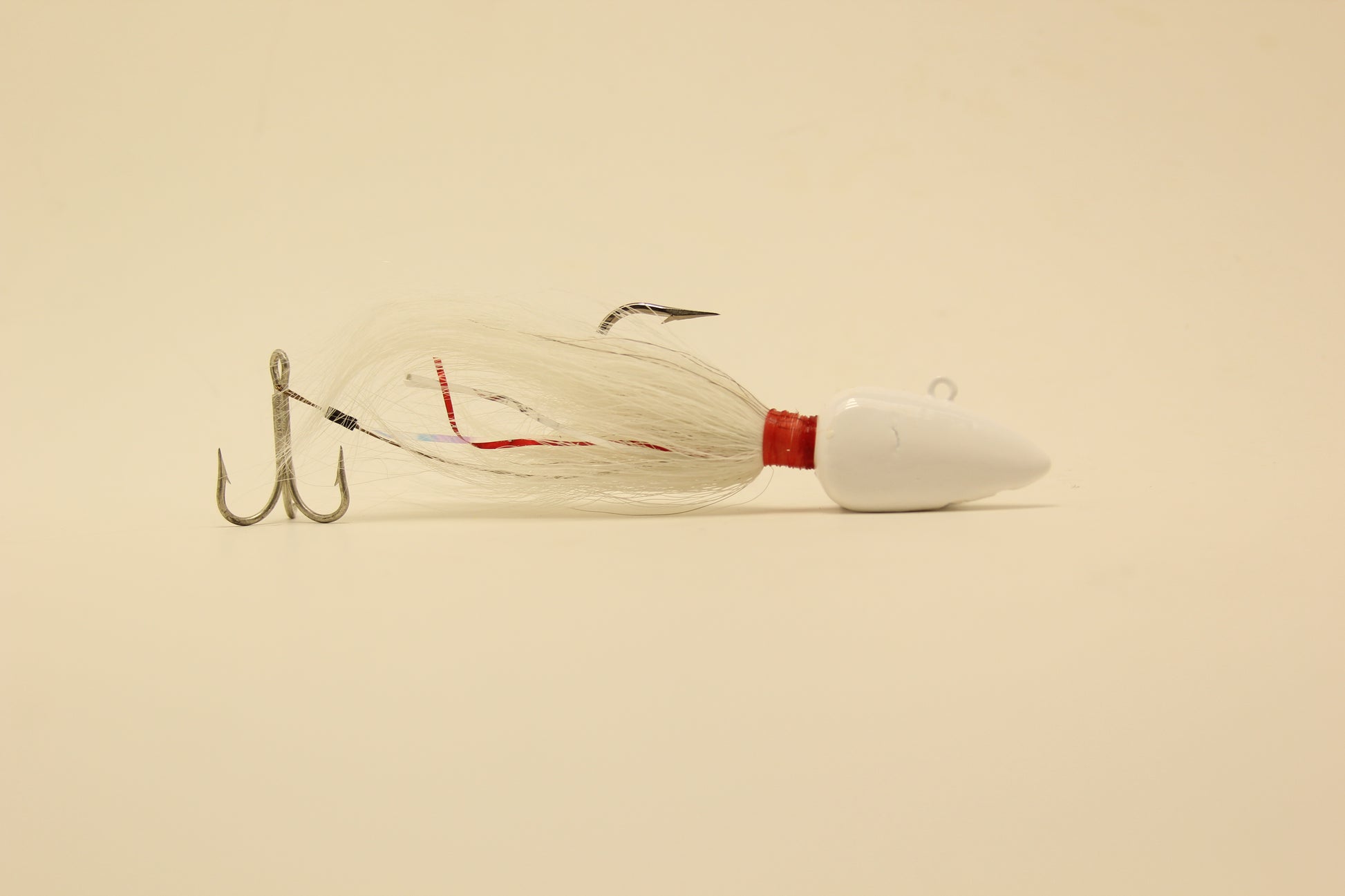White Buck tails, grouper jigs, saltwater lures, Flair Hawks.